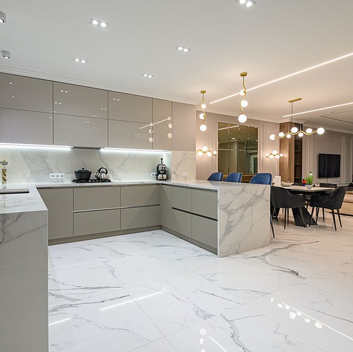Luxury large modern white marble kitchen united with dining room