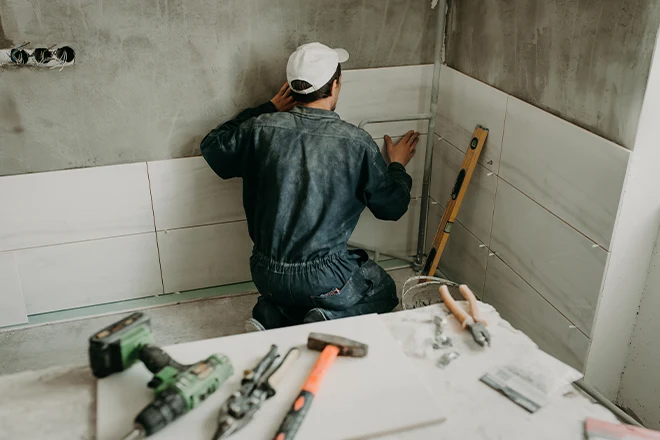 Installing large white ceramic shower tiles