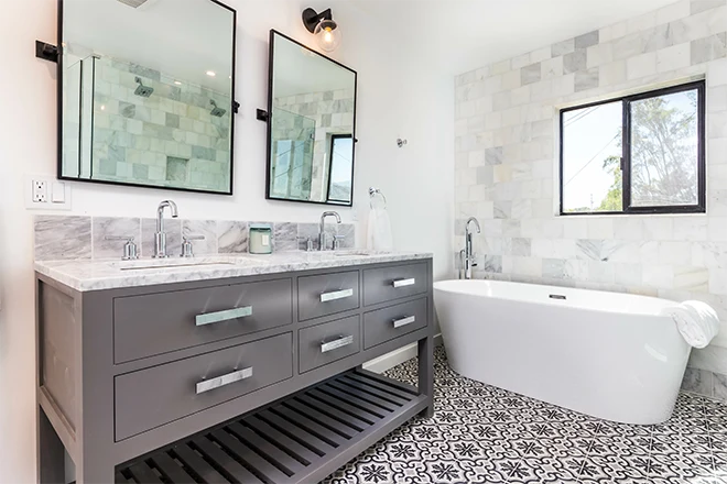 Bathroom with double vanity freestanding tub and custom tile floor