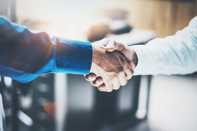 Shaking hands representing using the bathroom remodeling contractor hiring tips to find a good contractor