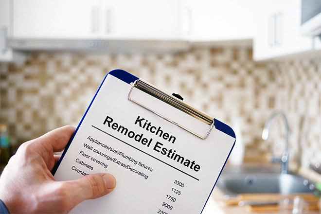 Kitchen remodel estimate clipboard representing how to budget for a kitchen remodel
